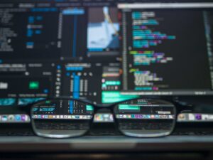 glasses in front of computer screen