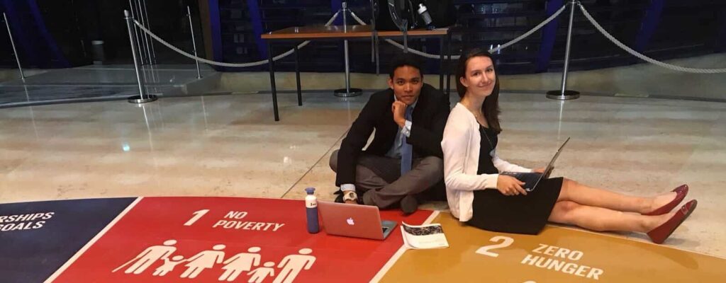 two students with laptops