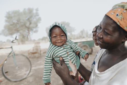 woman and baby smiling